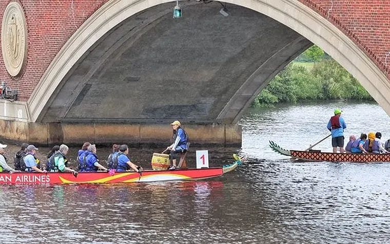 people rowing boats