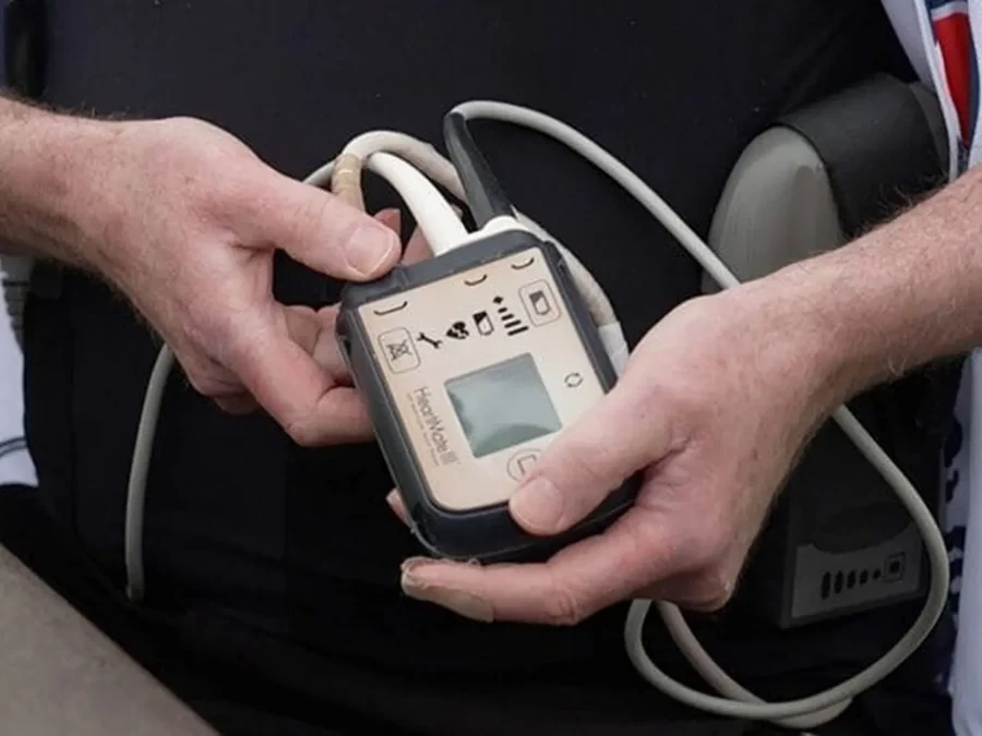 man holding lvad controller