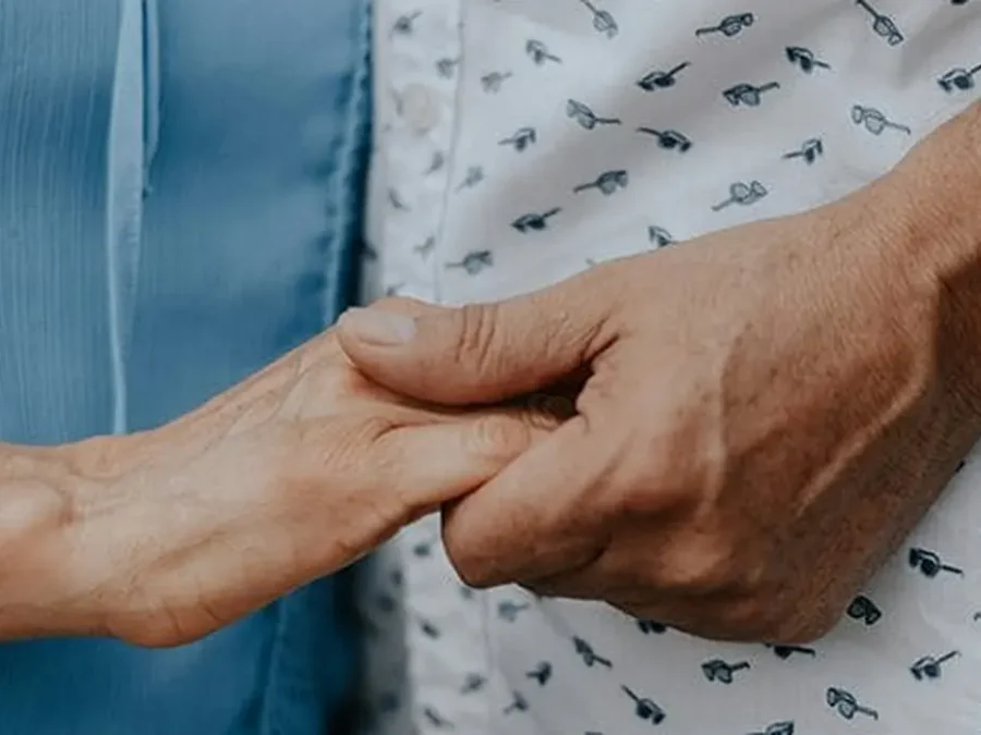 two people holding hands